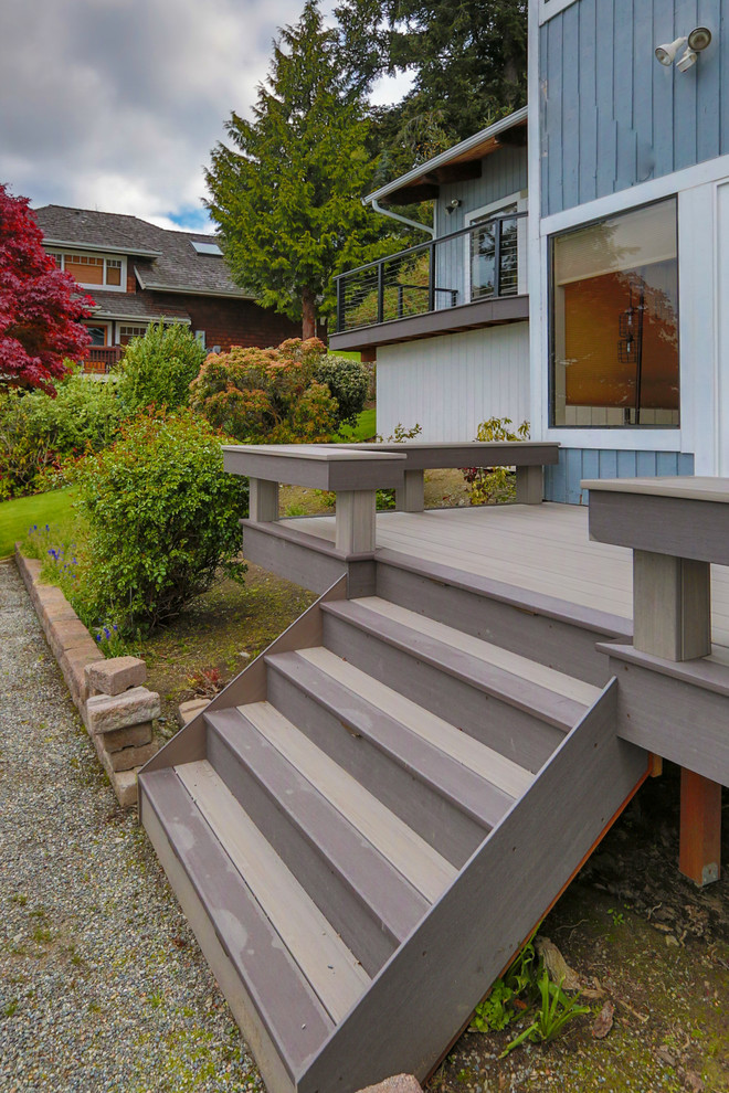 Design ideas for a large beach style side yard deck in Seattle.