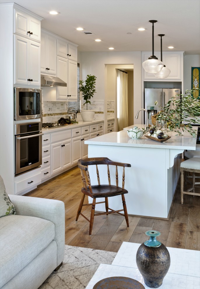 This is an example of a mid-sized beach style kitchen in San Francisco with medium hardwood floors and brown floor.