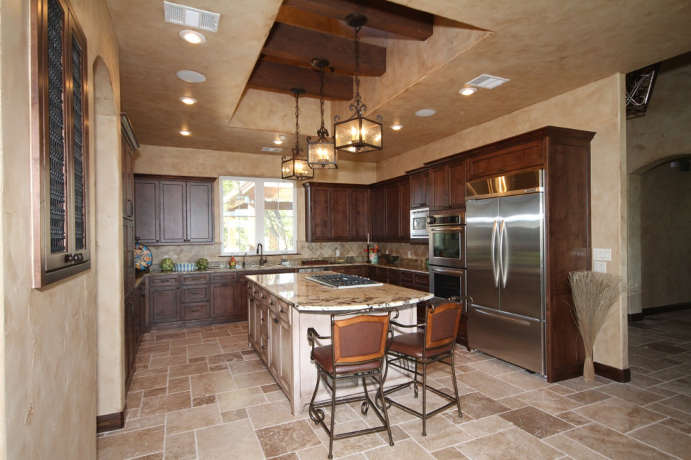 Example of a large tuscan kitchen design in Tampa