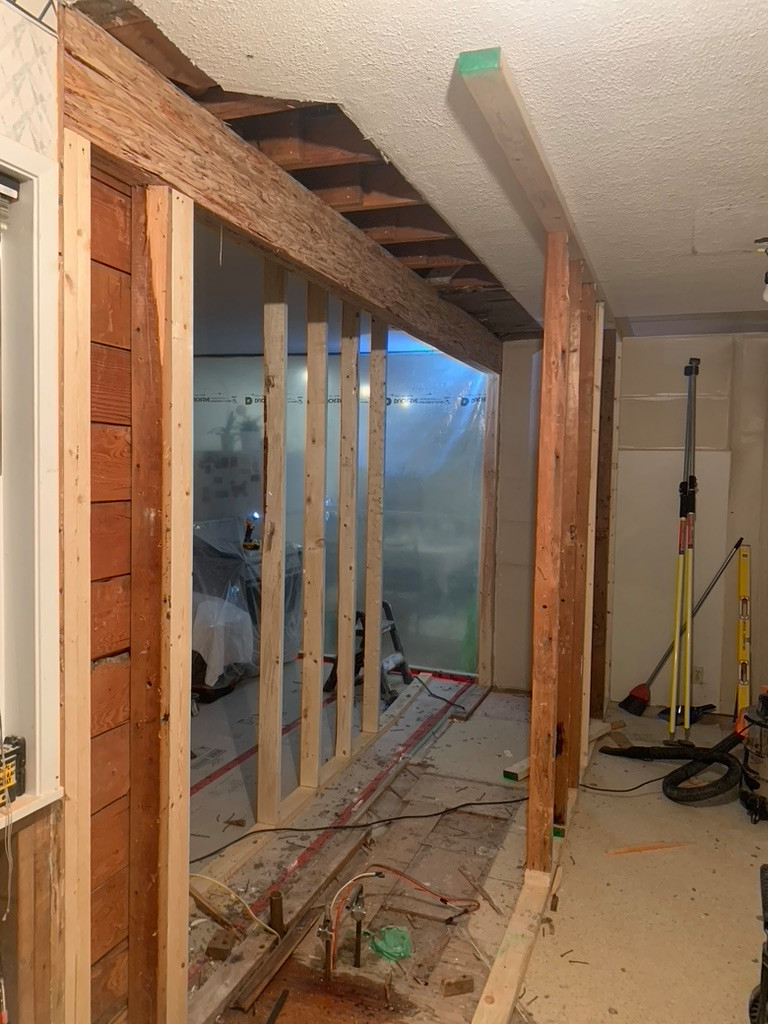 Remove wall and install beam. Install new kitchen.