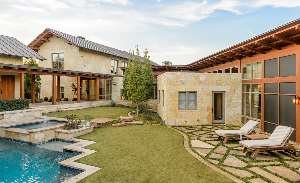 Huge backyard custom-shaped pool photo in Dallas