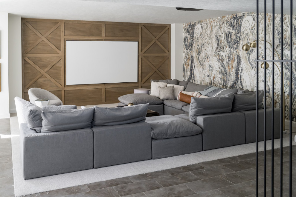 This is an example of a mid-sized beach style enclosed home theatre in Indianapolis with multi-coloured walls, marble floors and a projector screen.