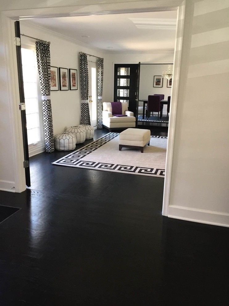 This is an example of a large contemporary formal open concept living room in Baltimore with white walls, dark hardwood floors, a wall-mounted tv and black floor.