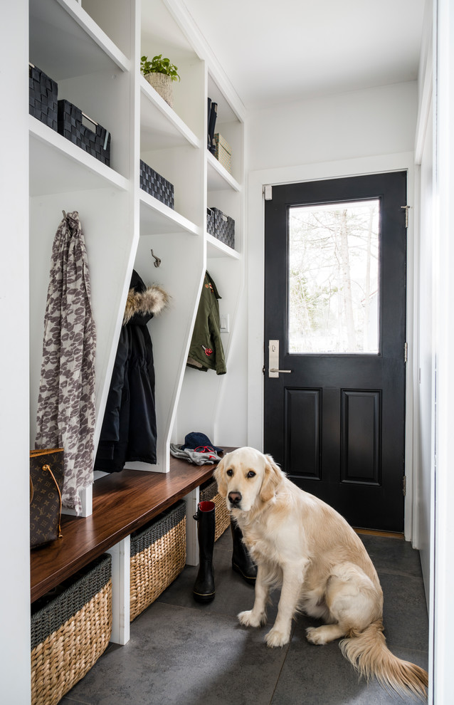 Small country mudroom in Boston with grey walls, ceramic floors and grey floor.