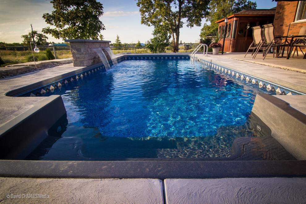 Inspiration for a small transitional backyard concrete and rectangular pool fountain remodel in Toronto