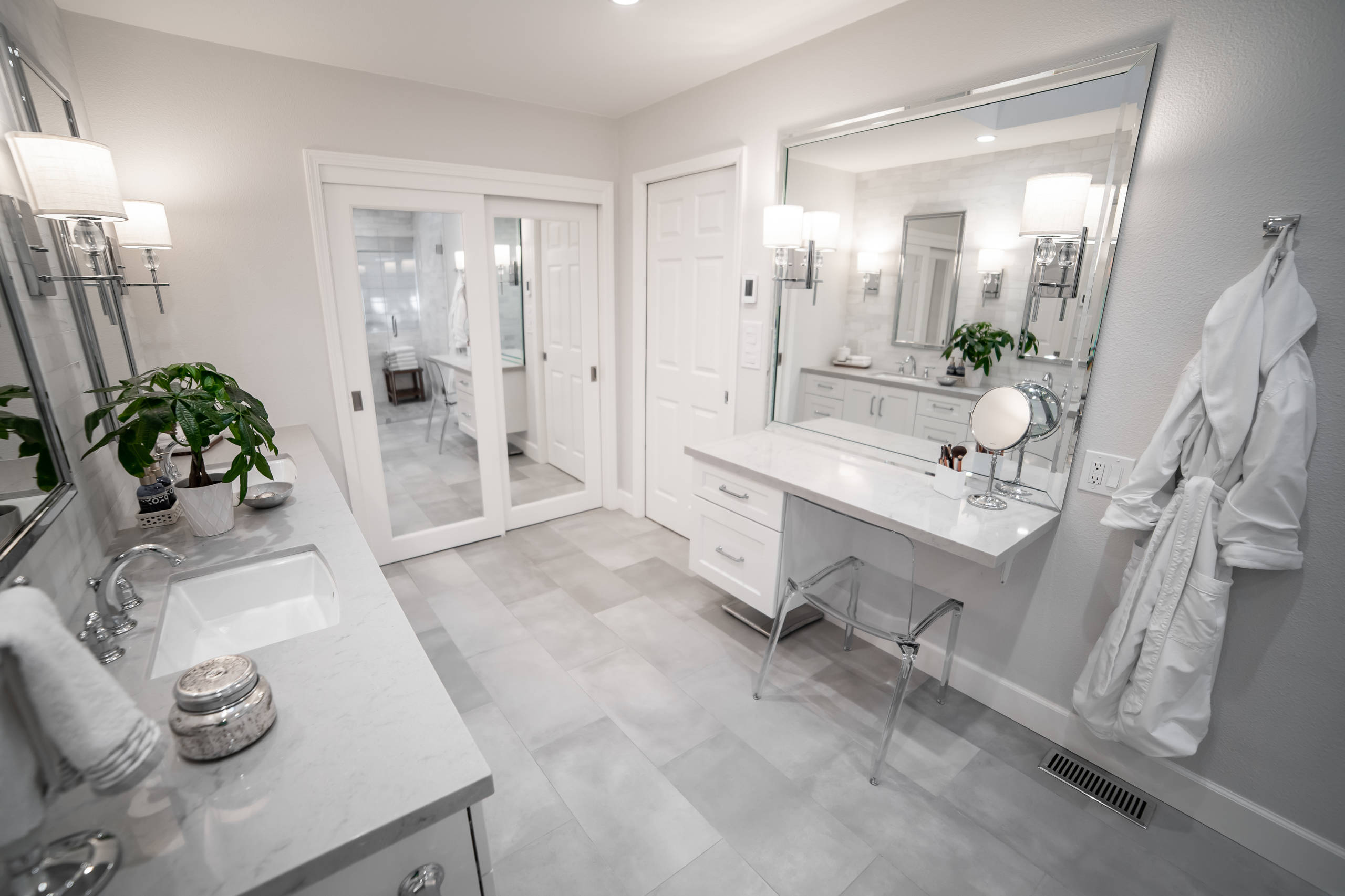 Inspiration for a mid-sized transitional master white tile and marble tile cement tile floor and gray floor alcove shower remodel in San Francisco with recessed-panel cabinets, white cabinets, a two-p
