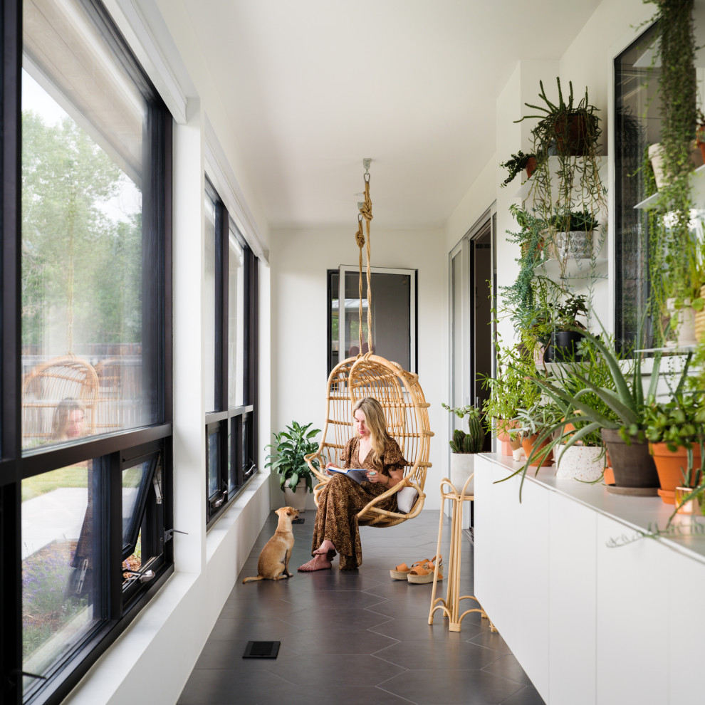 Photo of a scandinavian sunroom in Los Angeles with a skylight.