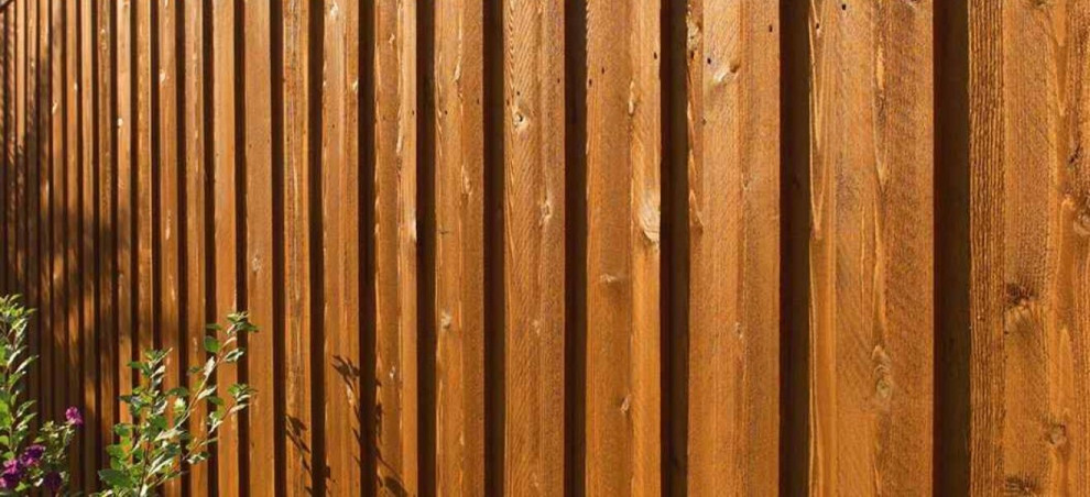 Photo of a rustic privacy backyard wood fence landscaping in Other.