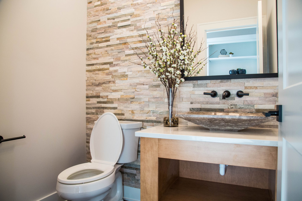 This is an example of an expansive modern bathroom in Indianapolis with brown cabinets, a two-piece toilet, beige walls, a vessel sink, quartz worktops, white worktops and a single sink.