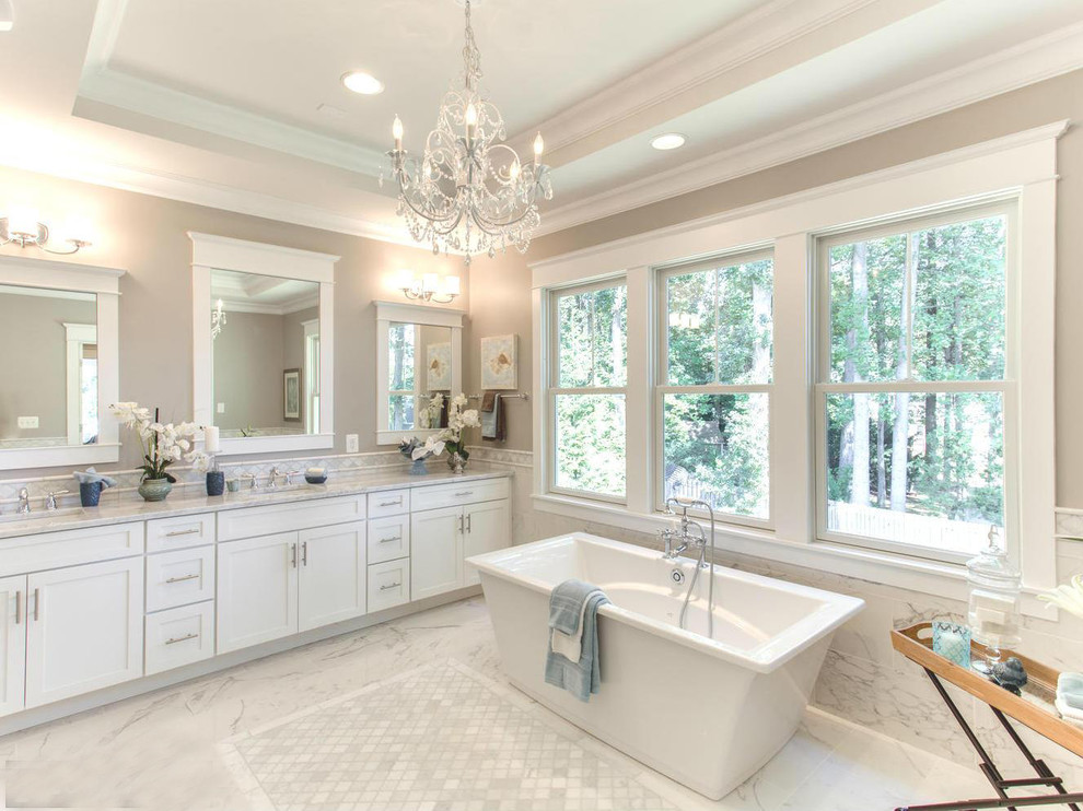 Large traditional master bathroom in DC Metro with shaker cabinets and a freestanding tub.