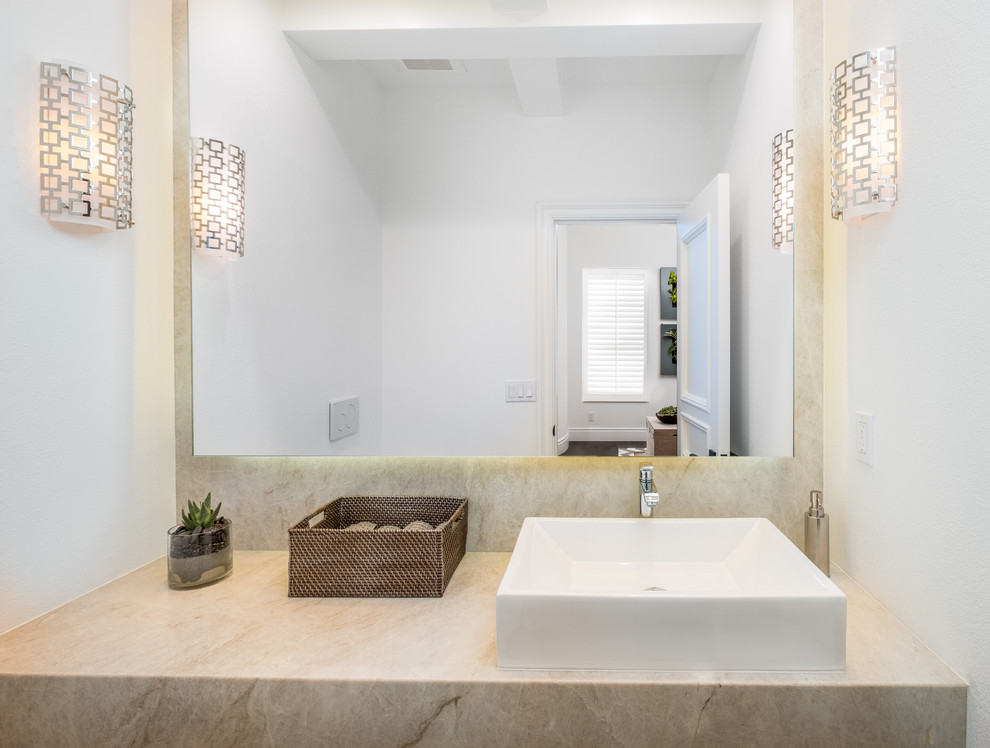 Small contemporary powder room in Orange County with white walls, dark hardwood floors, a vessel sink, engineered quartz benchtops, brown floor and beige benchtops.