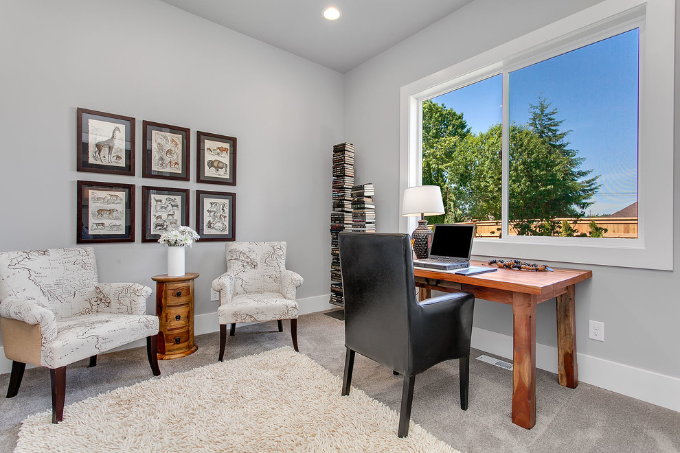 Photo of a mid-sized transitional study room in Seattle with grey walls, carpet and a freestanding desk.