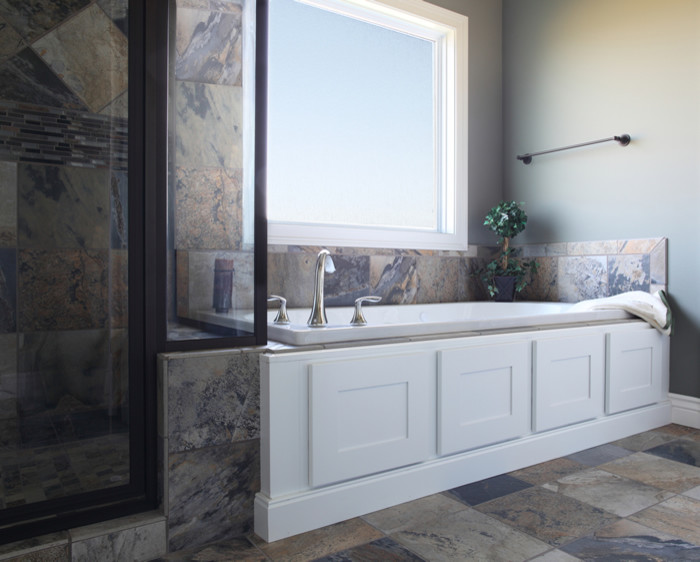 This is an example of a mid-sized traditional master bathroom in Indianapolis with shaker cabinets, dark wood cabinets, a drop-in tub, a corner shower, multi-coloured tile, ceramic tile, green walls and ceramic floors.