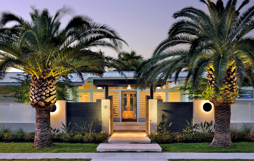 Inspiration for a tropical one-storey exterior in Miami.