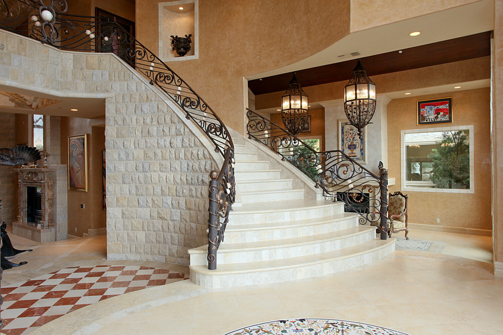 This is an example of a large mediterranean curved staircase in Las Vegas.