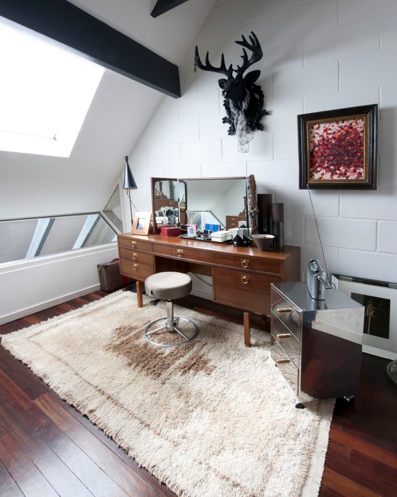 Inspiration for an eclectic bedroom in Hampshire with white walls and dark hardwood floors.