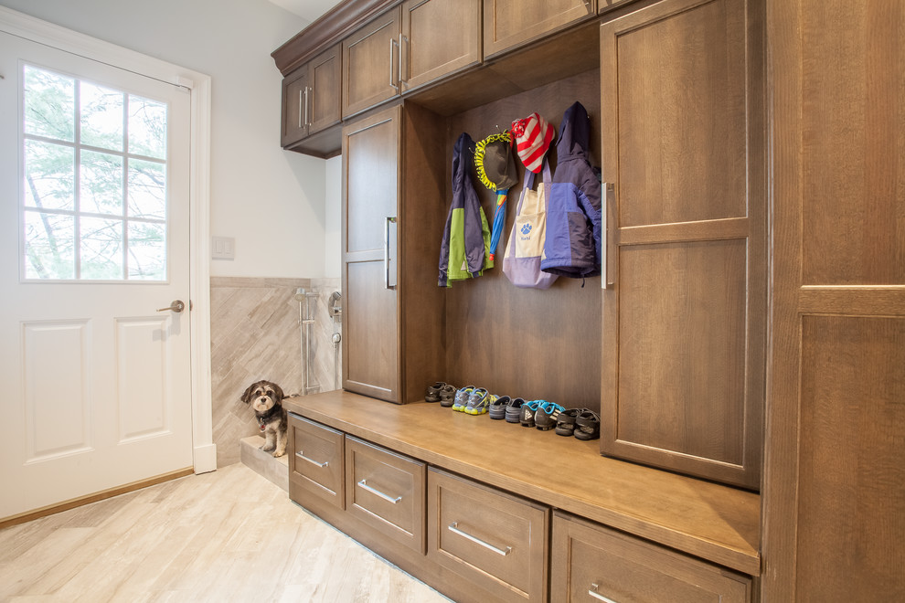 Transitional mudroom in New York with white walls, a single front door, a white front door and beige floor.