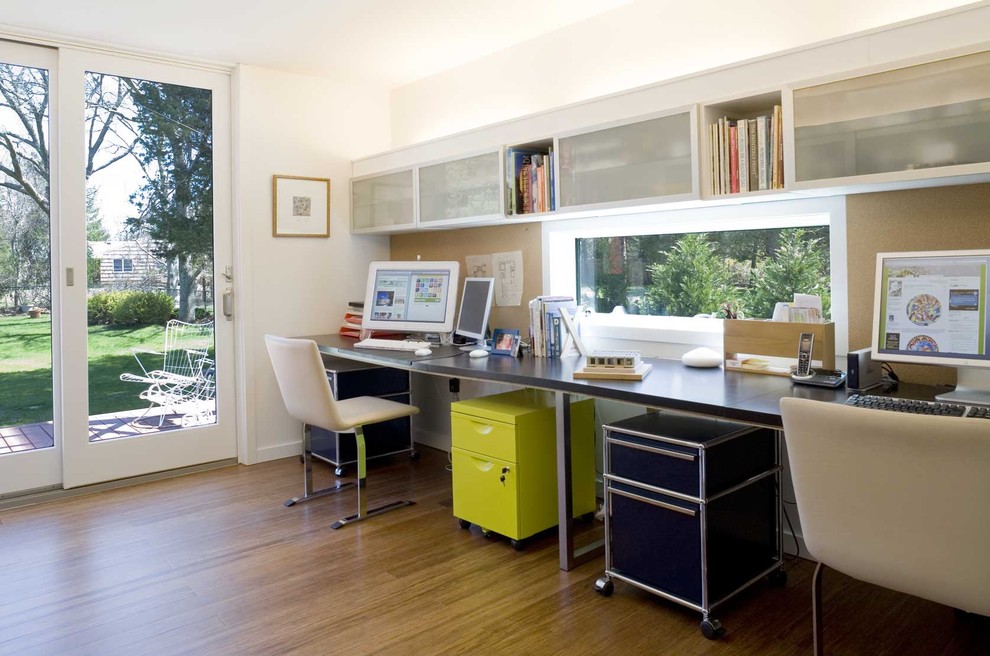 Inspiration for a modern home office in New York with bamboo floors.