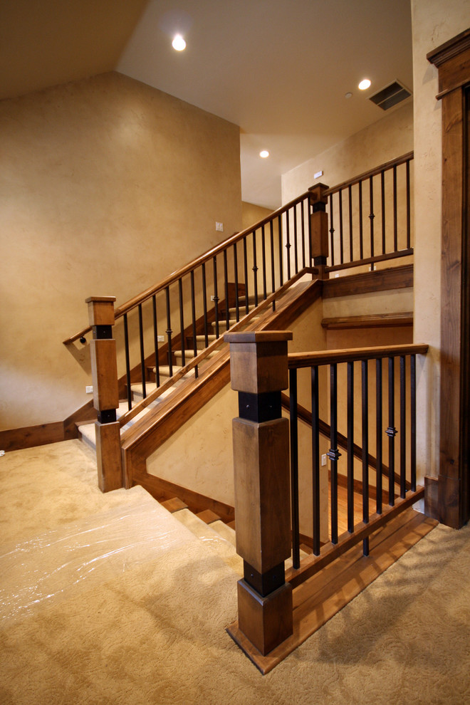 Inspiration for a small traditional carpeted u-shaped staircase in Salt Lake City with carpet risers.