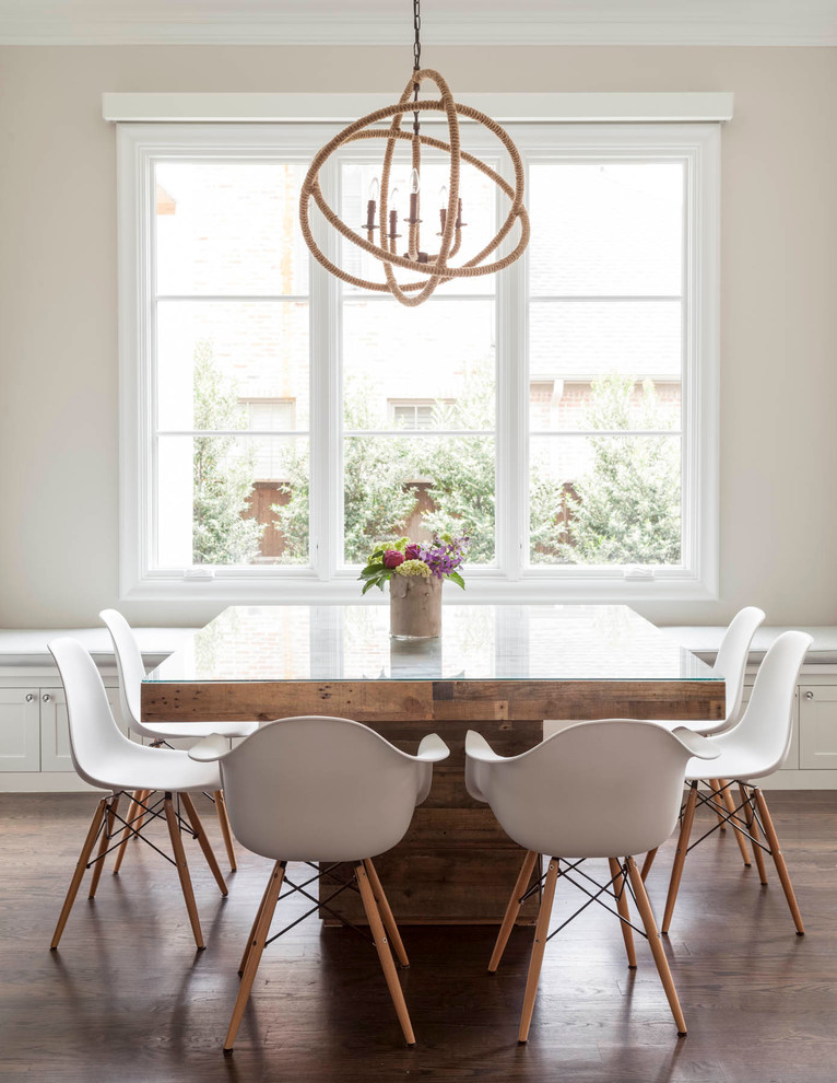 Design ideas for a transitional dining room in Dallas with medium hardwood floors and beige walls.