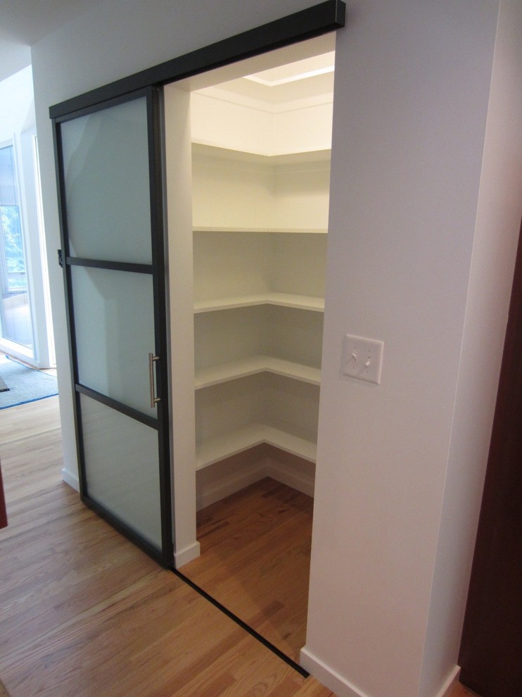 Photo of a contemporary storage and wardrobe in Detroit.