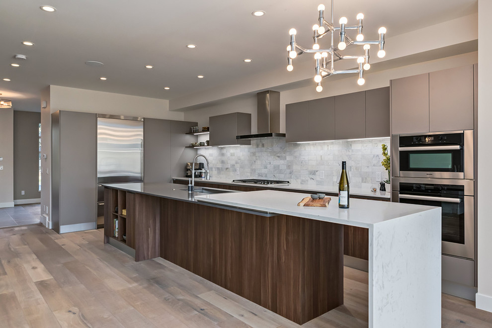Design ideas for a large contemporary l-shaped eat-in kitchen in Calgary with a double-bowl sink, flat-panel cabinets, medium wood cabinets, quartz benchtops, white splashback, cement tile splashback, stainless steel appliances, ceramic floors and with island.