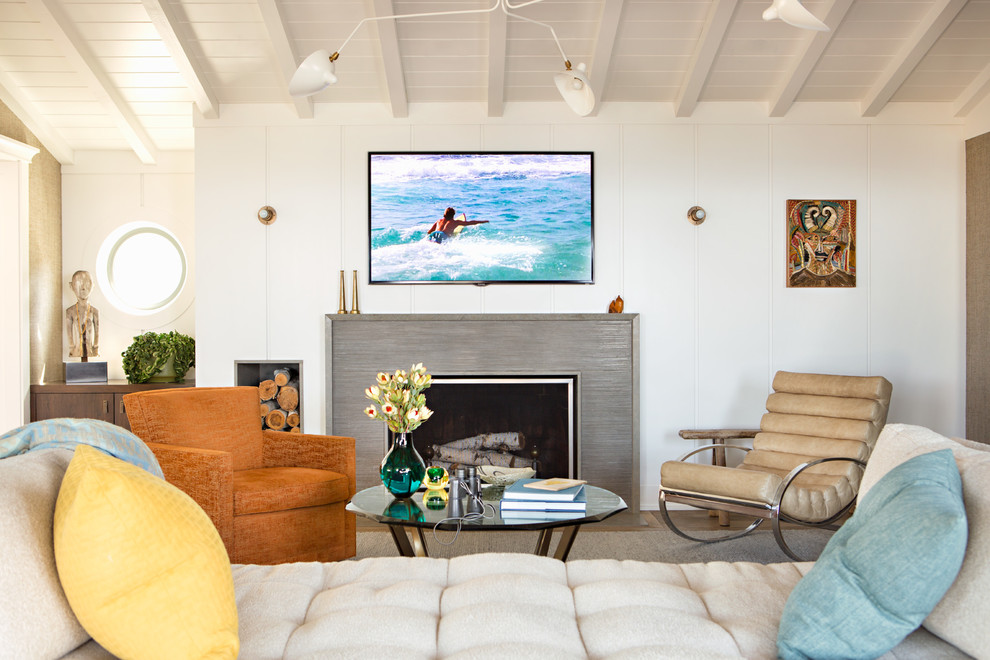 Inspiration for a beach style living room in Orange County with white walls and a standard fireplace.
