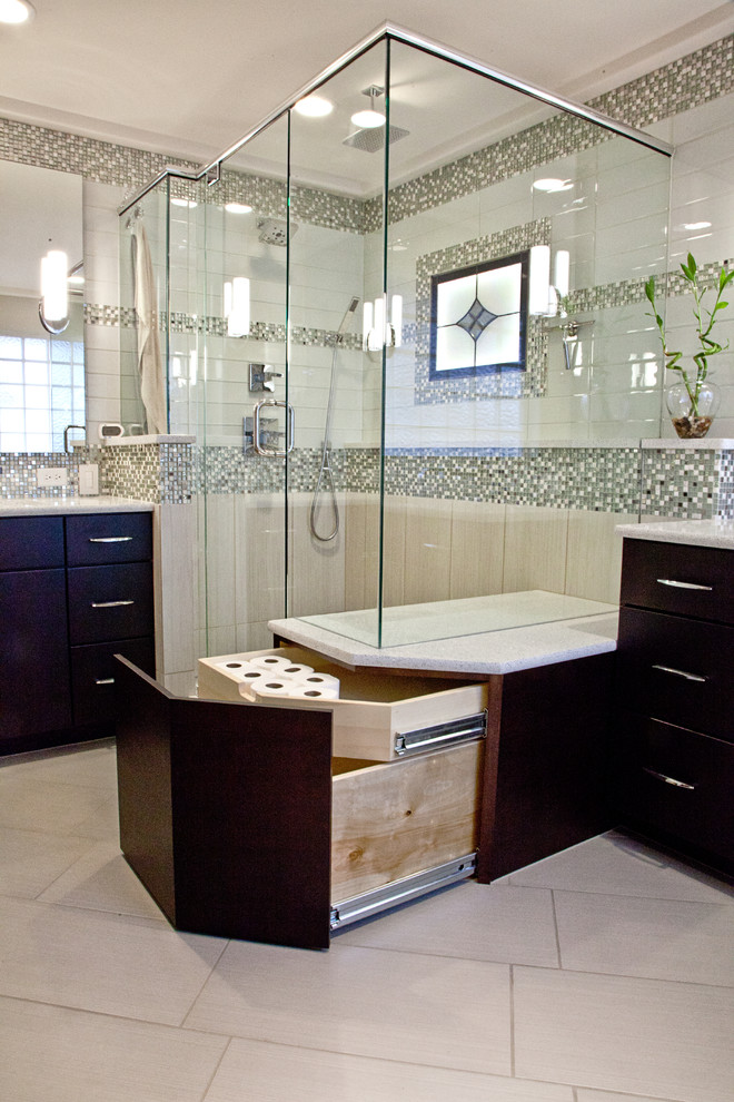 Modern master bathroom in Wichita with an undermount sink, flat-panel cabinets, dark wood cabinets, a corner shower, beige tile and beige walls.