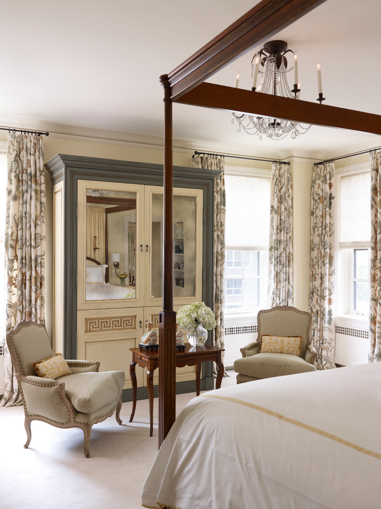Inspiration for a traditional master bedroom in Chicago with beige walls.