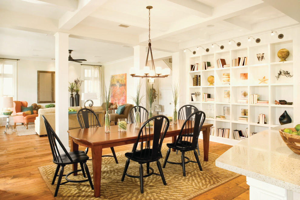 This is an example of a large transitional open plan dining in Tampa with white walls, medium hardwood floors, no fireplace and brown floor.