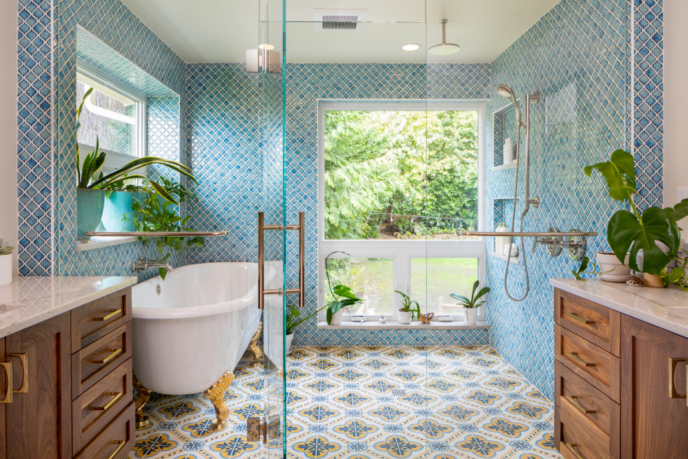 Example of a large tuscan master blue tile and porcelain tile cement tile floor, multicolored floor and double-sink bathroom design in Seattle with shaker cabinets, medium tone wood cabinets, a one-piece toilet, white walls, an undermount sink, quartzite countertops, a hinged shower door, white countertops, a niche and a built-in vanity