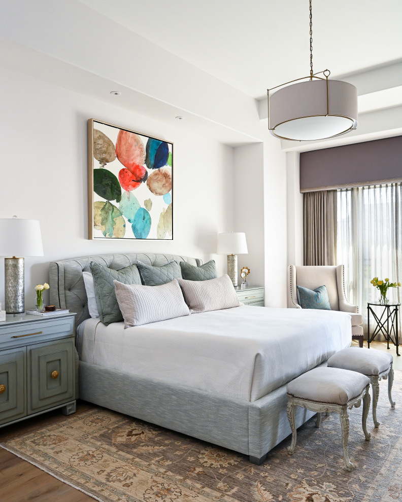 Design ideas for a large master bedroom with medium hardwood floors.