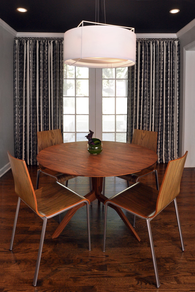 Photo of a small modern kitchen/dining combo in Chicago with grey walls, dark hardwood floors and no fireplace.