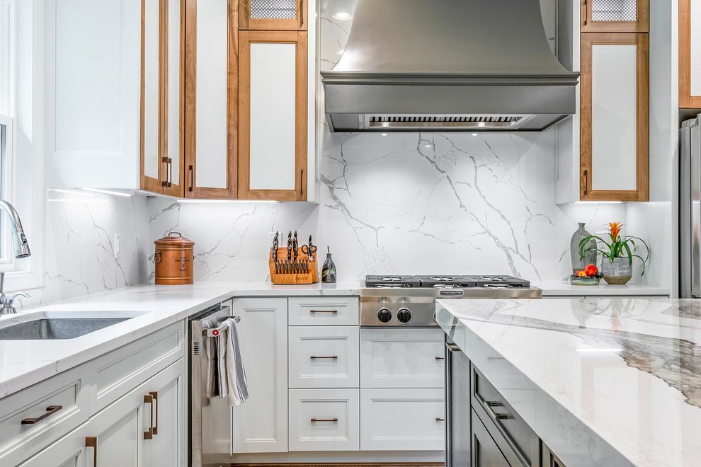 Inspiration for a large midcentury eat-in kitchen in Other with a drop-in sink, shaker cabinets, white cabinets, quartz benchtops, white splashback, stainless steel appliances, ceramic floors, with island, beige floor and white benchtop.
