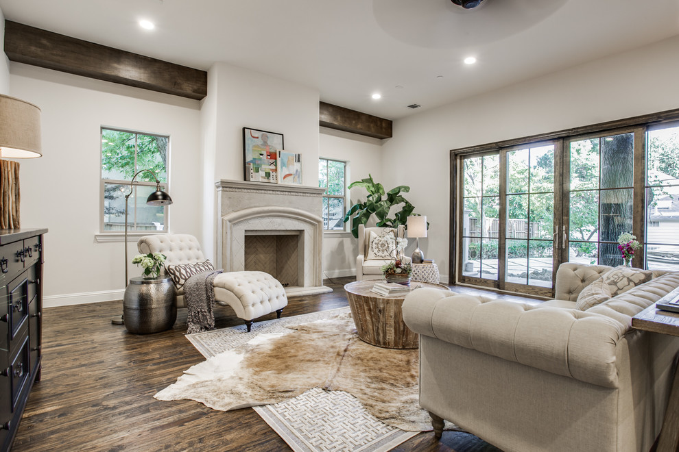 Large mediterranean open concept living room in Dallas with white walls, dark hardwood floors, a standard fireplace and a stone fireplace surround.