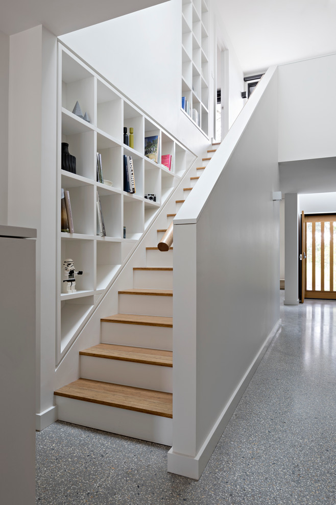 Mid-sized contemporary wood straight staircase in Melbourne with painted wood risers.