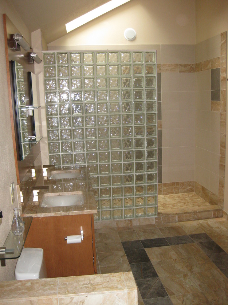 Large transitional master multicolored tile and porcelain tile marble floor and beige floor drop-in bathtub photo in DC Metro with flat-panel cabinets, medium tone wood cabinets, a one-piece toilet, beige walls, an undermount sink and marble countertops