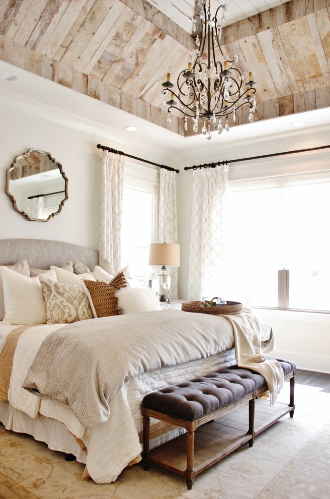 This is an example of a transitional master bedroom in Nashville with white walls, dark hardwood floors and no fireplace.