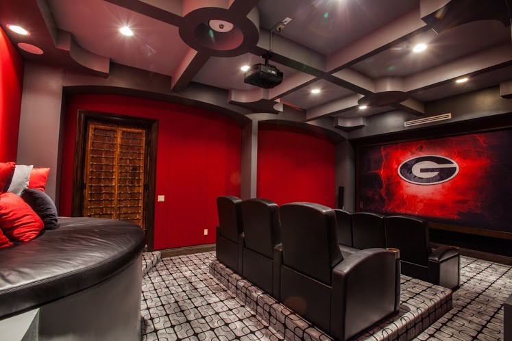 Mid-sized contemporary enclosed home theatre in Miami with red walls, carpet and a projector screen.