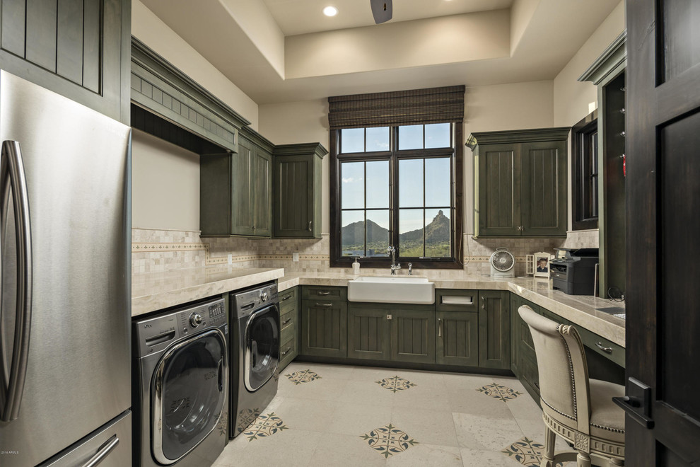 This is an example of a large contemporary u-shaped utility room in Phoenix with a farmhouse sink, recessed-panel cabinets, grey cabinets, marble benchtops, beige walls, ceramic floors and a side-by-side washer and dryer.