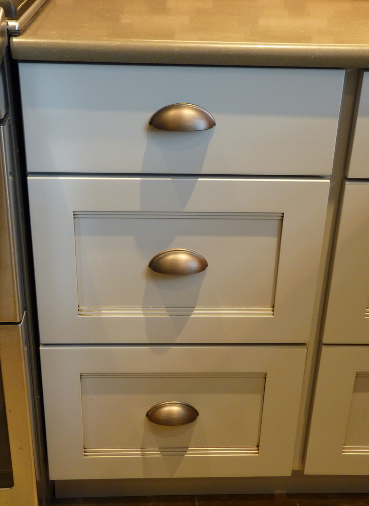 Example of a large transitional u-shaped porcelain tile and beige floor home design design in Philadelphia with a farmhouse sink, shaker cabinets, gray cabinets, quartz countertops, gray backsplash, mosaic tile backsplash, stainless steel appliances and an island