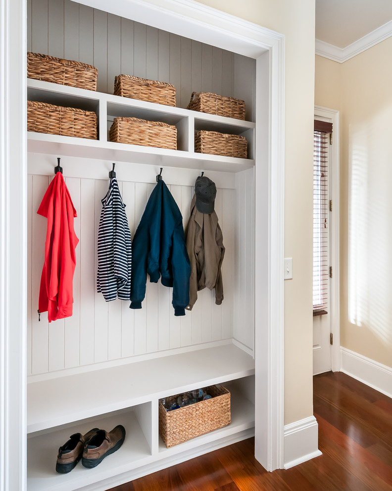 Design ideas for a mid-sized transitional mudroom in Atlanta with beige walls, medium hardwood floors, a single front door, a white front door and brown floor.