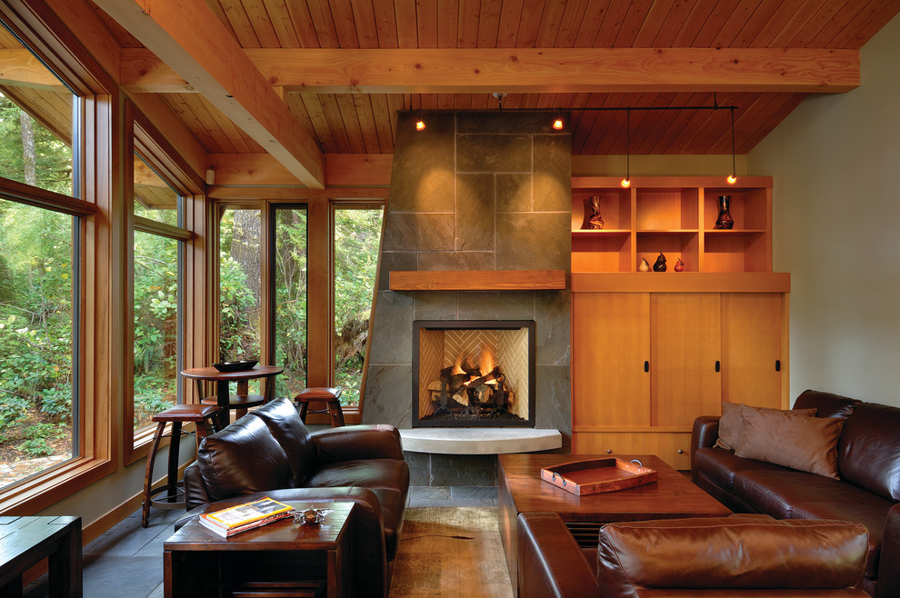 This is an example of a contemporary formal living room in Vancouver with grey walls, a standard fireplace and a tile fireplace surround.