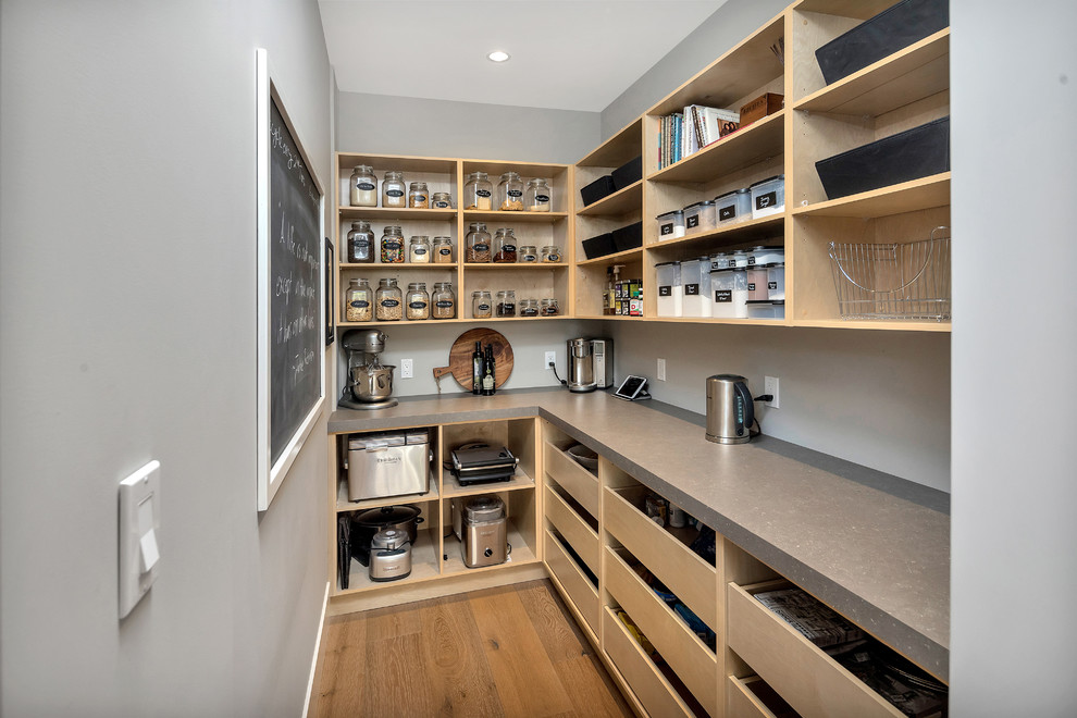 Transitional medium tone wood floor and brown floor kitchen photo