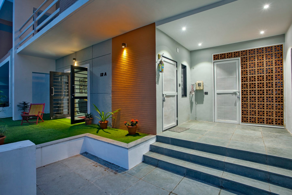 This is an example of a contemporary One-story exterior in Ahmedabad.