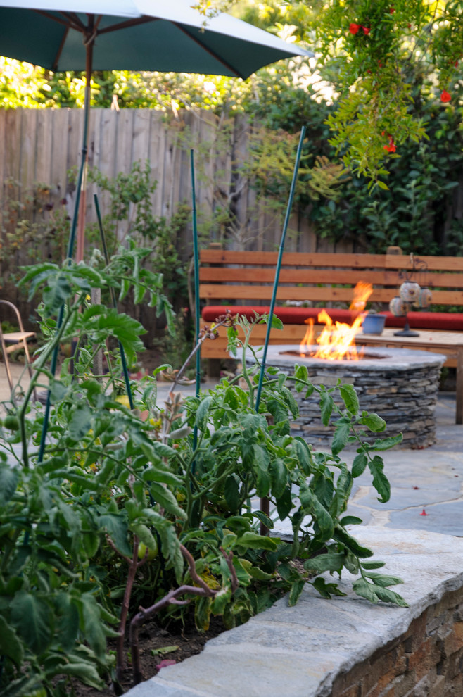Photo of a mid-sized traditional backyard partial sun formal garden in Los Angeles with a vegetable garden and gravel.