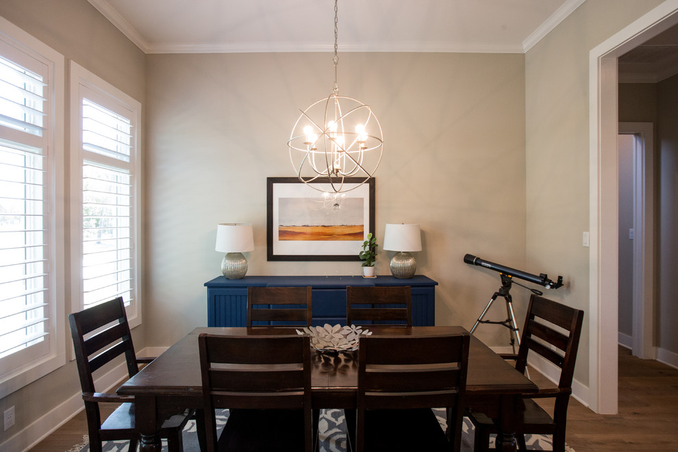 Example of a mid-sized transitional medium tone wood floor and brown floor kitchen/dining room combo design in Austin with beige walls and no fireplace