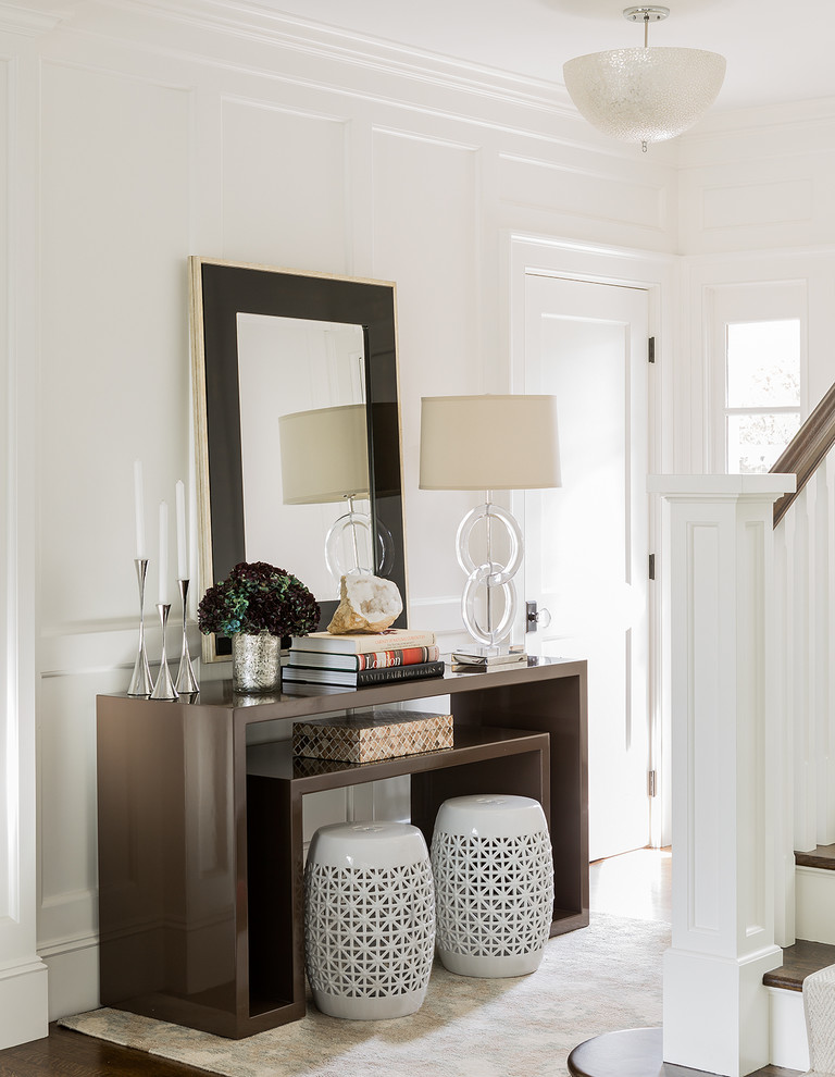 Inspiration for a small transitional dark wood floor entry hall remodel in Boston with white walls