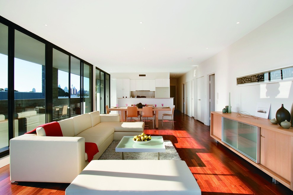 Inspiration for a contemporary open concept living room in Sydney with white walls.