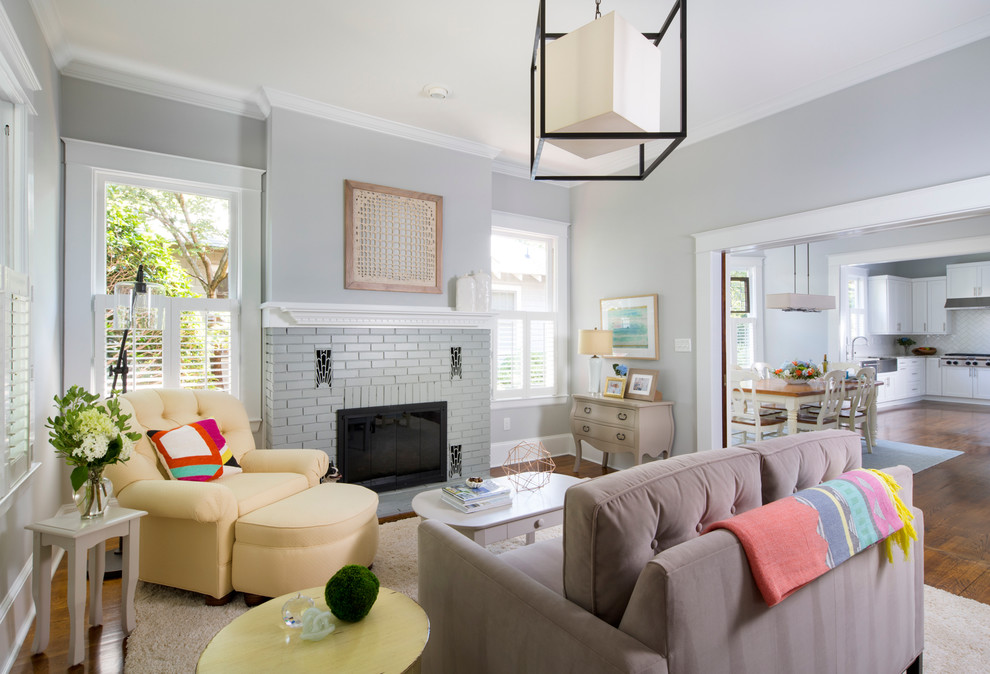 Inspiration for a mid-sized transitional open concept living room in Charlotte with grey walls, dark hardwood floors, a standard fireplace and a brick fireplace surround.